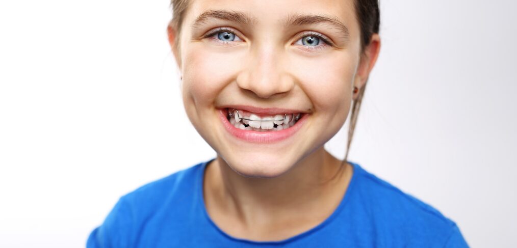 girl smiling with retainer