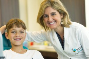 Dr. Adriana with a young patient at Bee Cave Ortho